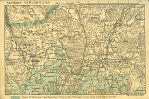 Ein alter Stadtplan von Karlsruhe, Deutschland, der detaillierte Straßen, Gebäude und Sehenswürdigkeiten zeigt, mit Text oben und unten.