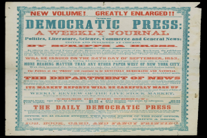 Zeitung mit dem Text "Demokratische Presse: Eine Wochenzeitung" auf einem schwarzen Hintergrund.